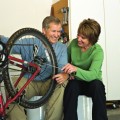 couple repairing bike