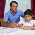 father and son studying at home