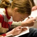 Girl taking notes in school