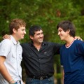 father talking with teen sons