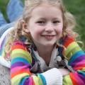 Girl smiling, relaxing outside