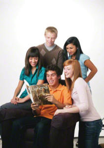 Youth reading LDS magazine