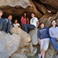 Teen girls sitting on rocks