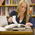 woman studying at library