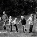 family outside holding hands
