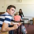 Teen boy in class
