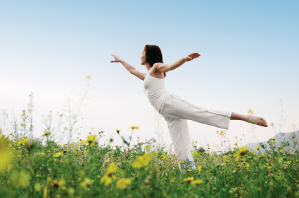 woman in arabesque in meadow