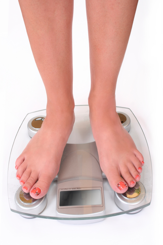 woman standing on scale