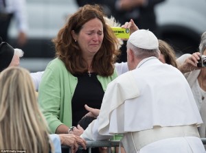 2CC977D500000578-3249997-A_woman_cries_as_Pope_Francis_blesses_her_disabled_son_upon_arri-a-134_1443278900428
