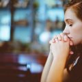 woman praying thinking