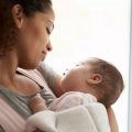 woman holding baby
