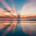 sunrise sunset ocean sky clouds