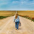 suitcase dirt road