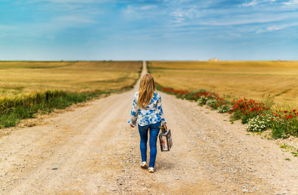 suitcase dirt road