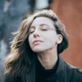 content woman breeze wind