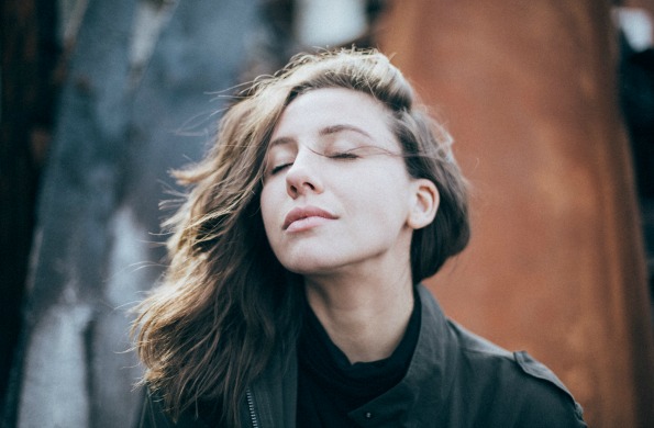 content woman breeze wind