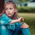 little girl bullying sticks and stones
