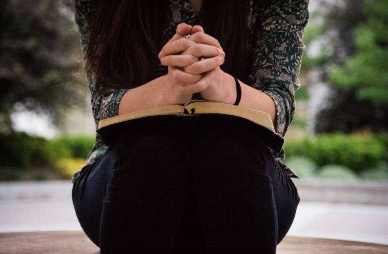 woman reading prayer