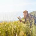 Man reading on bench